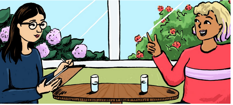 Image of a researcher and participant talking at the table